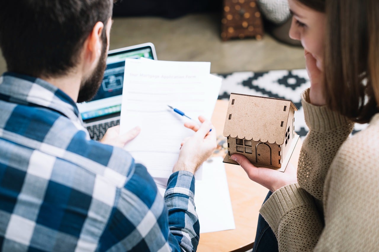 A couple reviewing beneficiary deed plans for their home